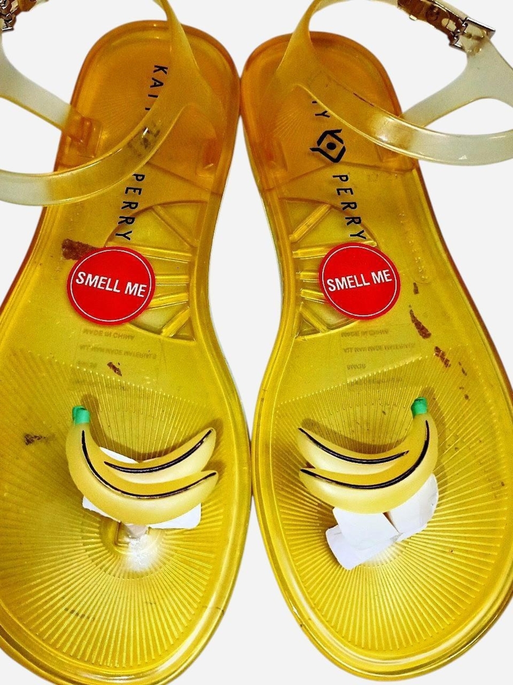 Katy Perry Gold Jelly Sandals with Orange Charm